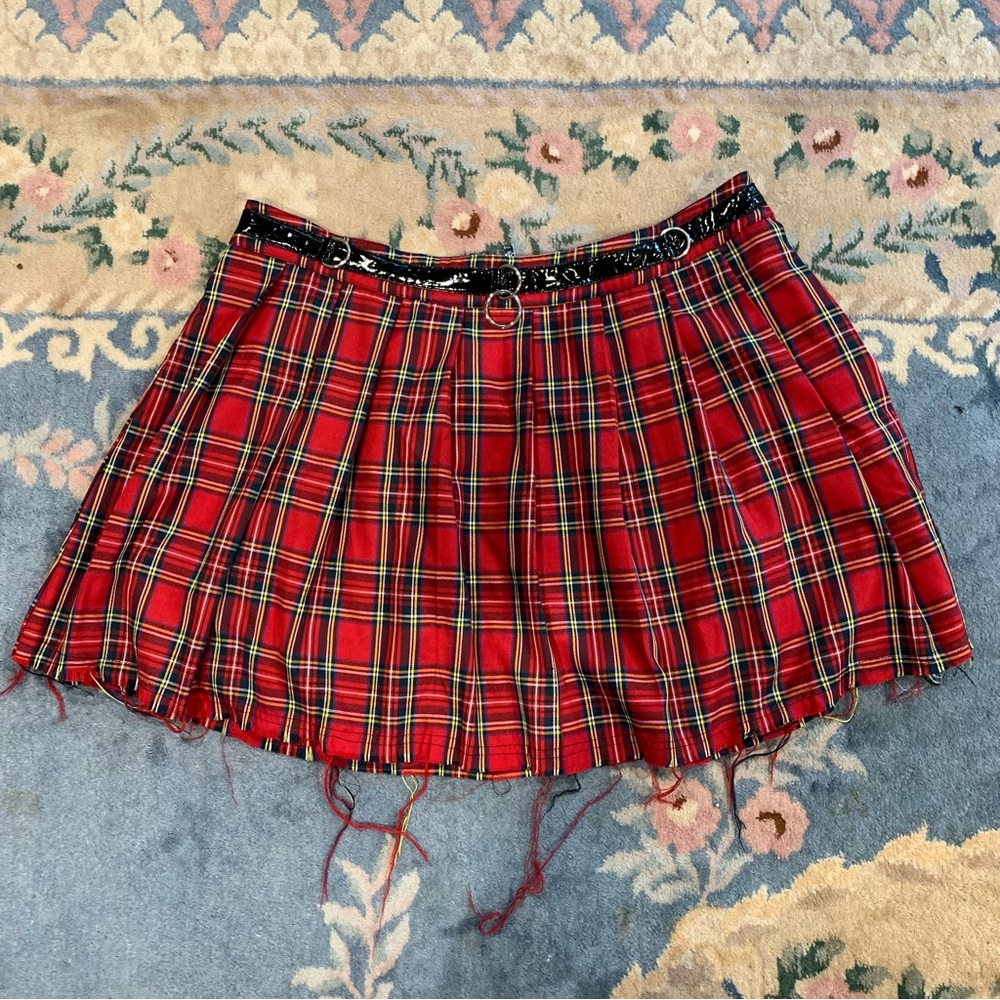 Dolls Kill plaid pleated skirt with frayed hem and o-ring belt detail